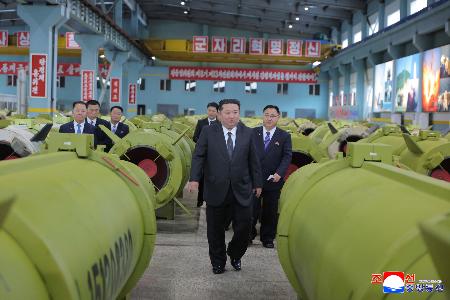 North Korean leader Kim Jong-un inspects major munitions factories while calling for expanding the production of missiles and shells, in this photo carried by the North's official Korean Central News Agency on Dec. 26. [KCNA]