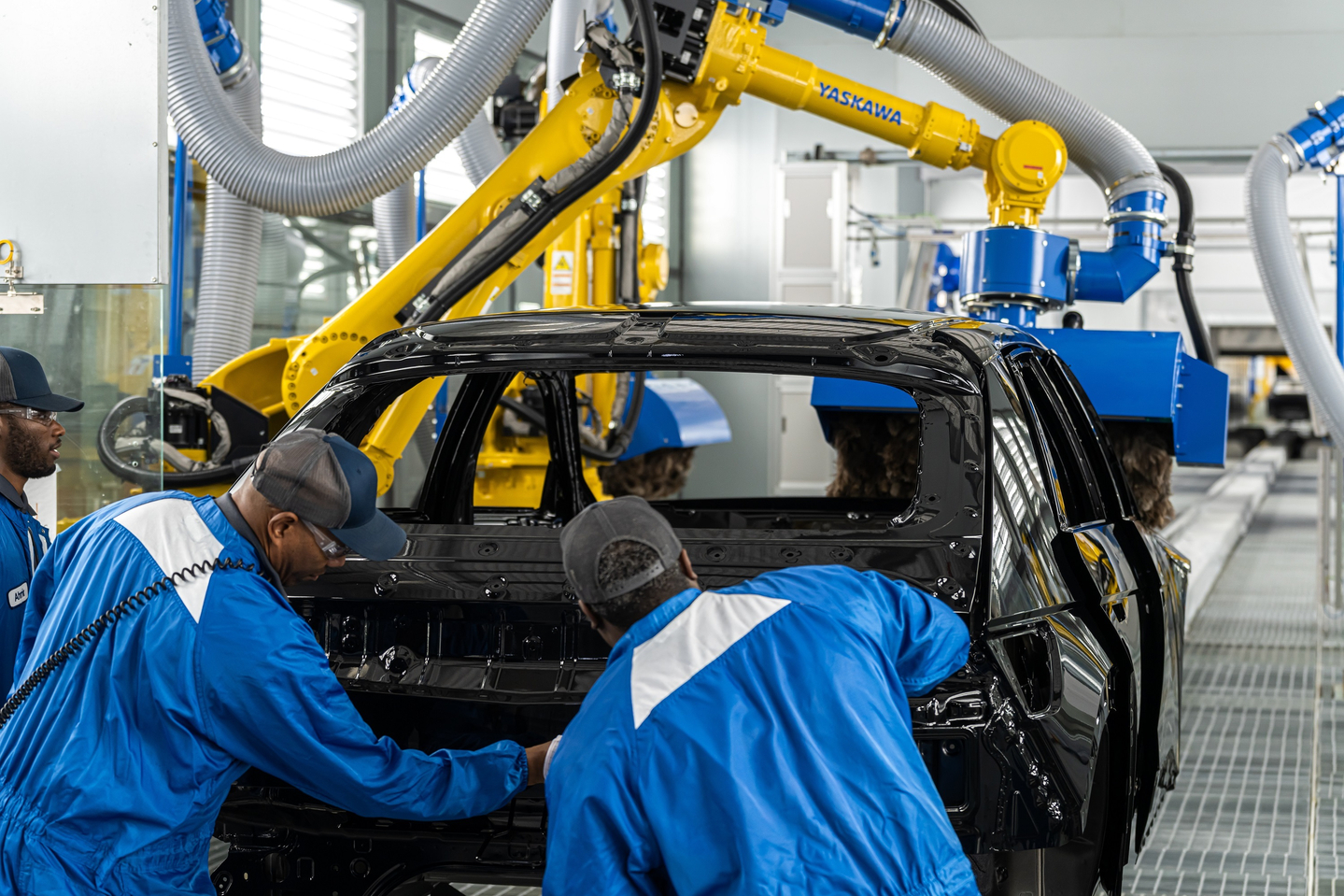 Workers are seen assembling an Ioniq 5 vehicle at the Hyundai Motor Group Metaplant America in Ellabell, Georgia on March 27. [HYUNDAI MOTOR]