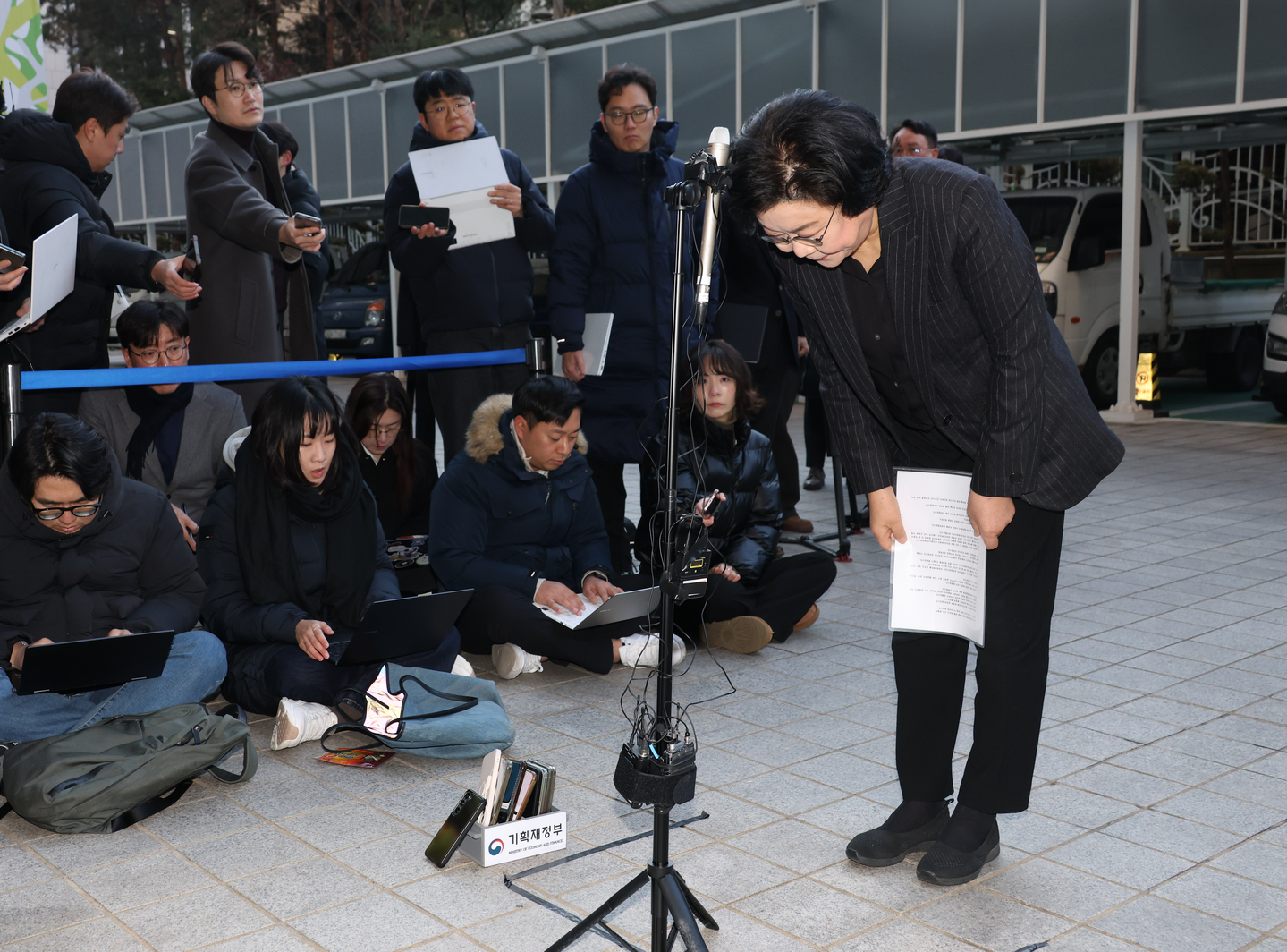 Lee Hye-hoon, the nominee for the new minister for planning and budget, talks to reporters while heading to her office to prepare for her parliamentary confirmation hearing in Seoul on Dec. 30. [YONHAP]