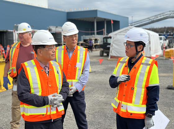 Jang In-hwa, CEO of Posco Holdings, second from left, examines the site of Ultium CAM, a joint venture between General Motors and the Korean firm’s subsidiary, Posco Future M, on April 29. [POSCO]