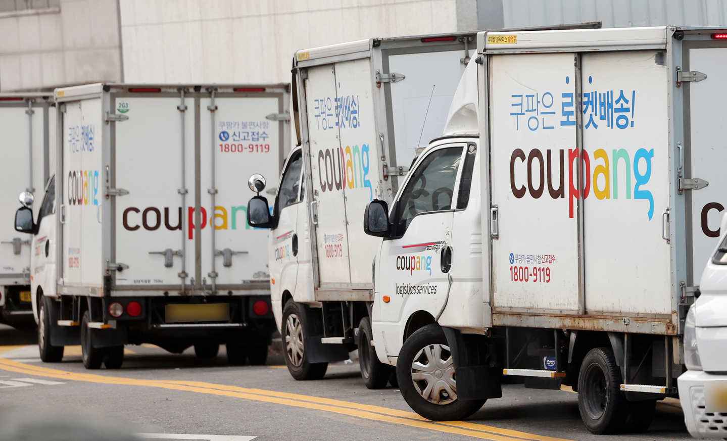 Delivery trucks are parked at a Coupang logistics center in Seoul on Dec. 28, 2025. [NEWS1] 