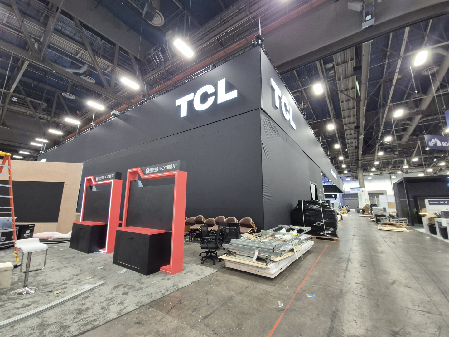 Chinese electronics company Hisense sets up its booth against the backdrop of TCL's exhibition space at CES 2026 at the Las Vegas Convention Center on Jan. 4. [YI WOO-LIM]