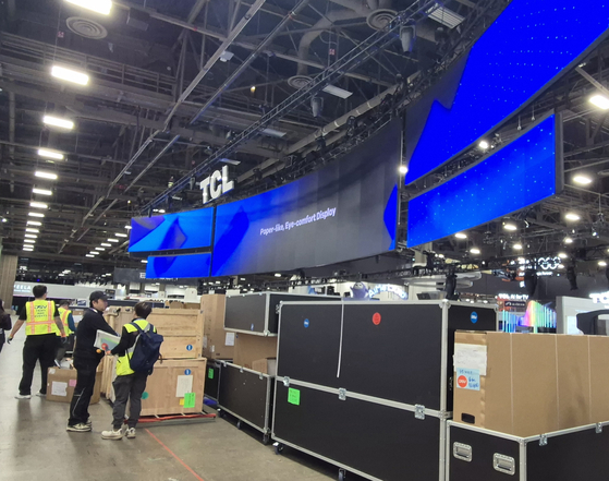 Chinese electronics maker TCL sets up its booth at CES 2026 at the Las Vegas Convention Center on Jan. 4. YI WOO-LIM