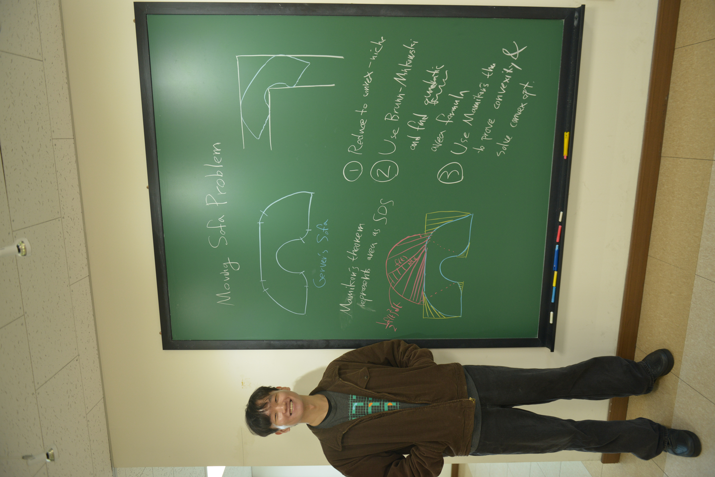 Baek Jin-eon, a researcher at the June E Huh Center for Mathematical Challenges at the Korea Institute for Advanced Study, explains the moving sofa problem. [KOREA INSTITUTE FOR ADVANCED STUDY]
