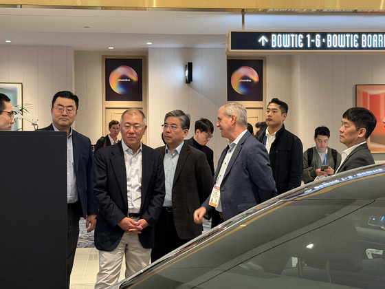 Hyundai Motor Group Executive Chair Euisun Chung, second from left, tours the Nvidia booth for the CES 2026 in Las Vegas on Jan. 6. [SARAH CHEA]