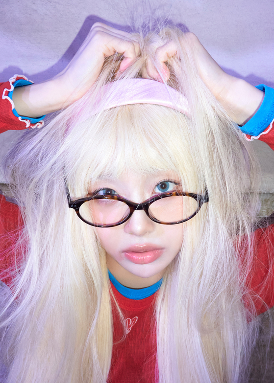 Singer Chuu in a promotional image for her first full-length album, ″XO, My Cyberlove″ [ATRP]