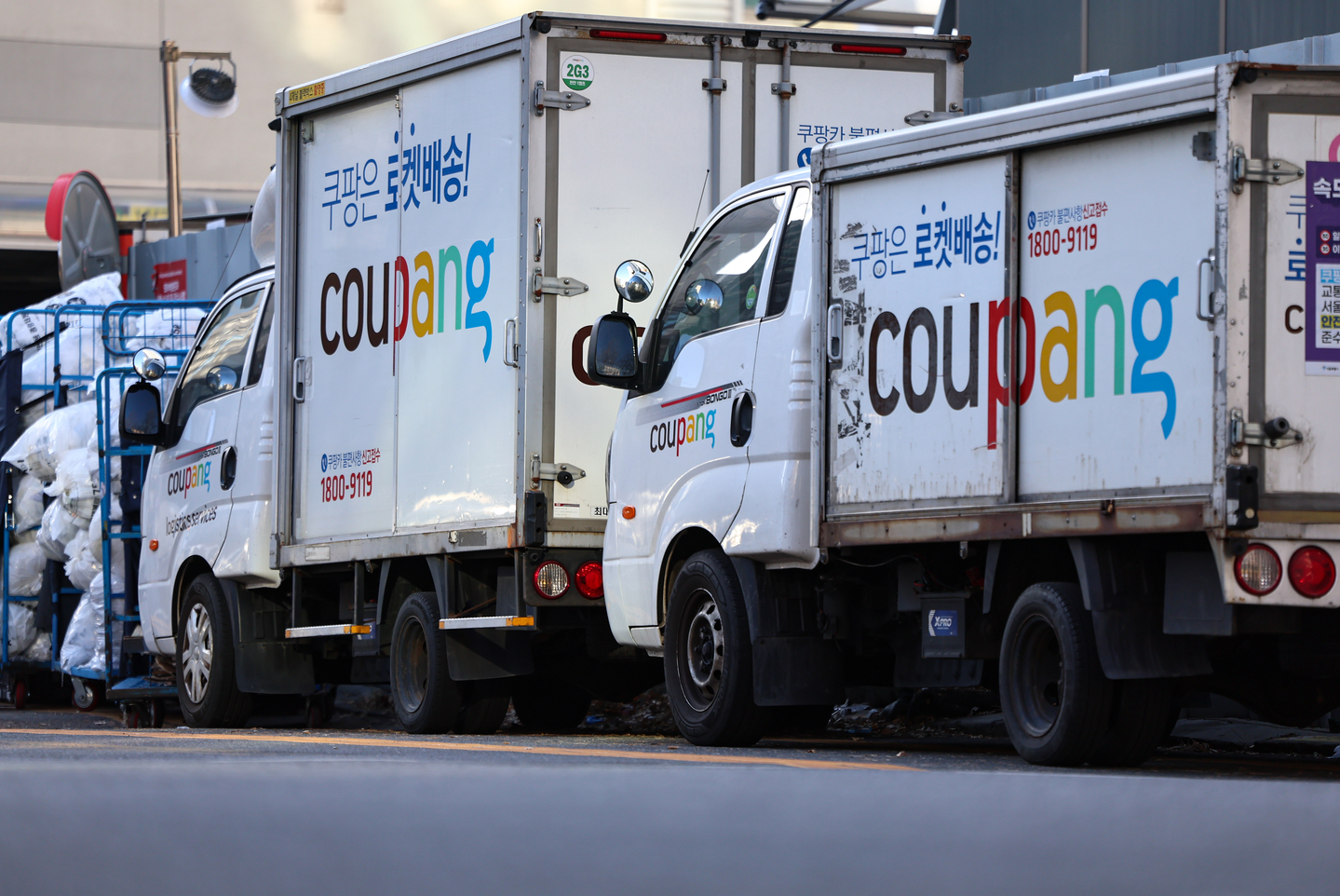 Coupang trucks are seen at a logistics center in downtown Seoul on Dec. 30, 2025. [NEWS1]