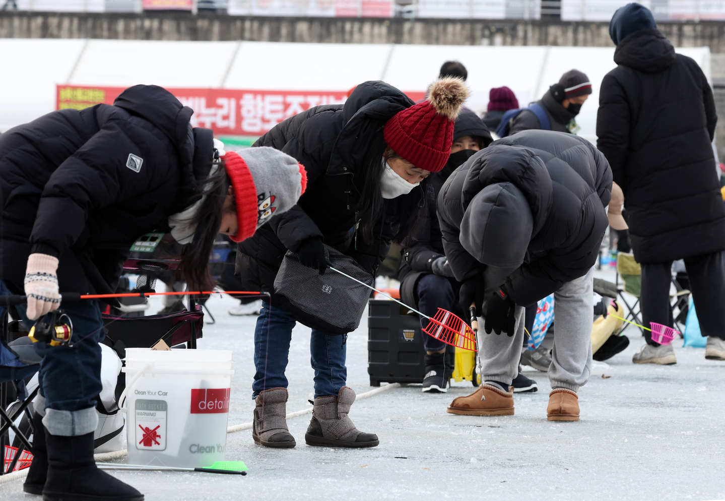 People fish at the Hwacheon Sancheoneo Ice Festival in Hwacheon County, Gangwon, on Jan. 10. [YONHAP]