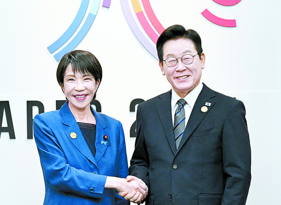 Korean President Lee Jae Myung, right, shakes hands with Japanese Prime Minister Sanae Takaichi during bilateral talks on the margins of the APEC gathering in Gyeongju, North Gyeongsang, on Oct. 30, 2025. [JOINT PRESS CORPS]