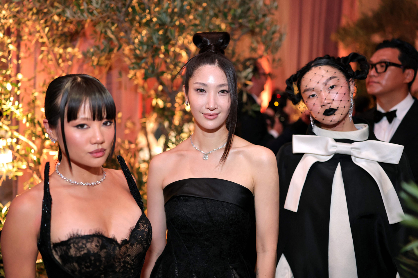 Rei Ami, left, EJAE, center, and Audrey Nuna attend the 83rd Annual Golden Globe Awards at The Beverly Hilton on Jan. 11, in Beverly Hills, California. [AFP/YONHAP]