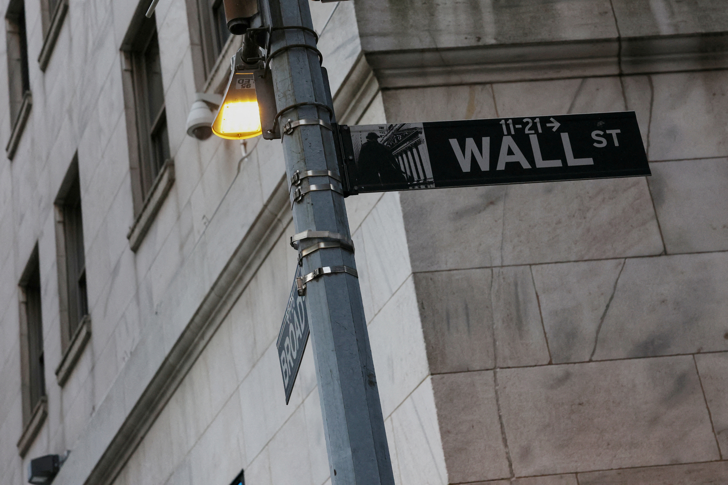 The Wall Street sign hangs outside the New York Stock Exchange building in New York on March 11, 2025. [REUTERS/YONHAP]