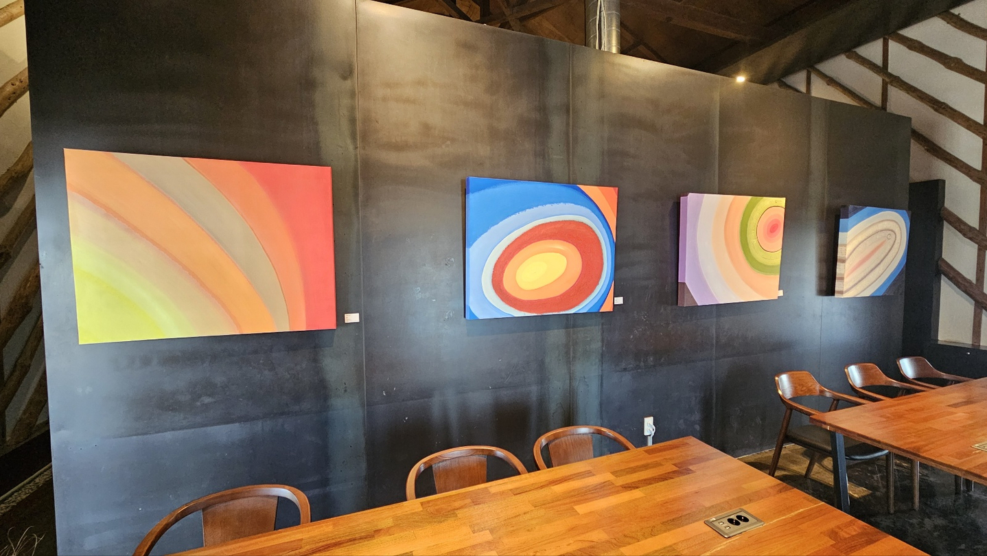 Paintings hang at a cafe in North Jeolla during a solo exhibition by a local police chief. [JOONGANG ILBO]