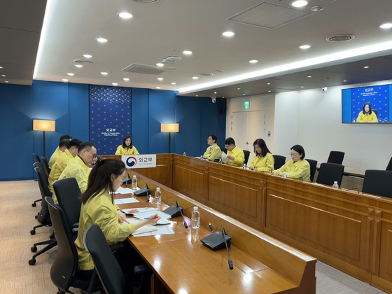 Second Vice Foreign Minister Kim Jina, fifth from right, presides over a meeting to check on the situation in Iran and the safety of Korean nationals there amid growing unrest in the Islamic republic on Jan. 13. [MINISTRY OF FOREIGN AFFAIRS] 