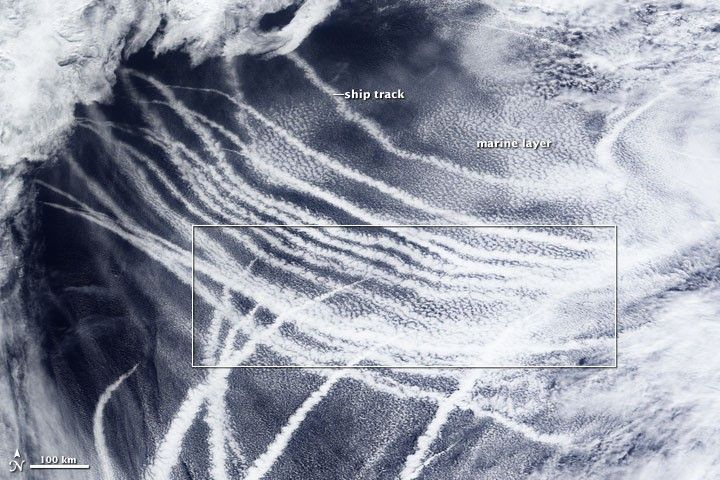 Ship tracks are seen over waters in the northeastern Pacific Ocean near Alaska on March 4, 2009. The long, streak-like clouds formed around particles contained in ship exhaust, a phenomenon that studies have found declined by about 80 percent following regulations introduced in 2020 to limit sulfur content in ship fuel. [NASA]