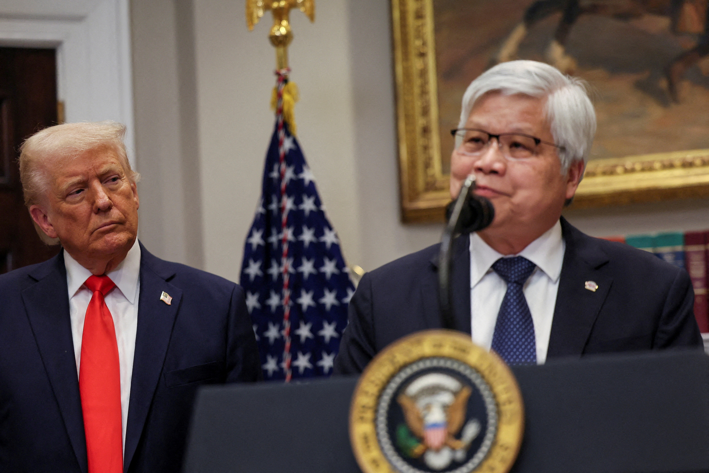 U.S. President Donald Trump listens to C.C. Wei, chairman and CEO of Taiwan Semiconductor Manufacturing Company (TSMC), as they make an announcement about an investment from TSMC in the Roosevelt Room at the White House in Washington on March 3, 2025. [REUTERS/YONHAP]