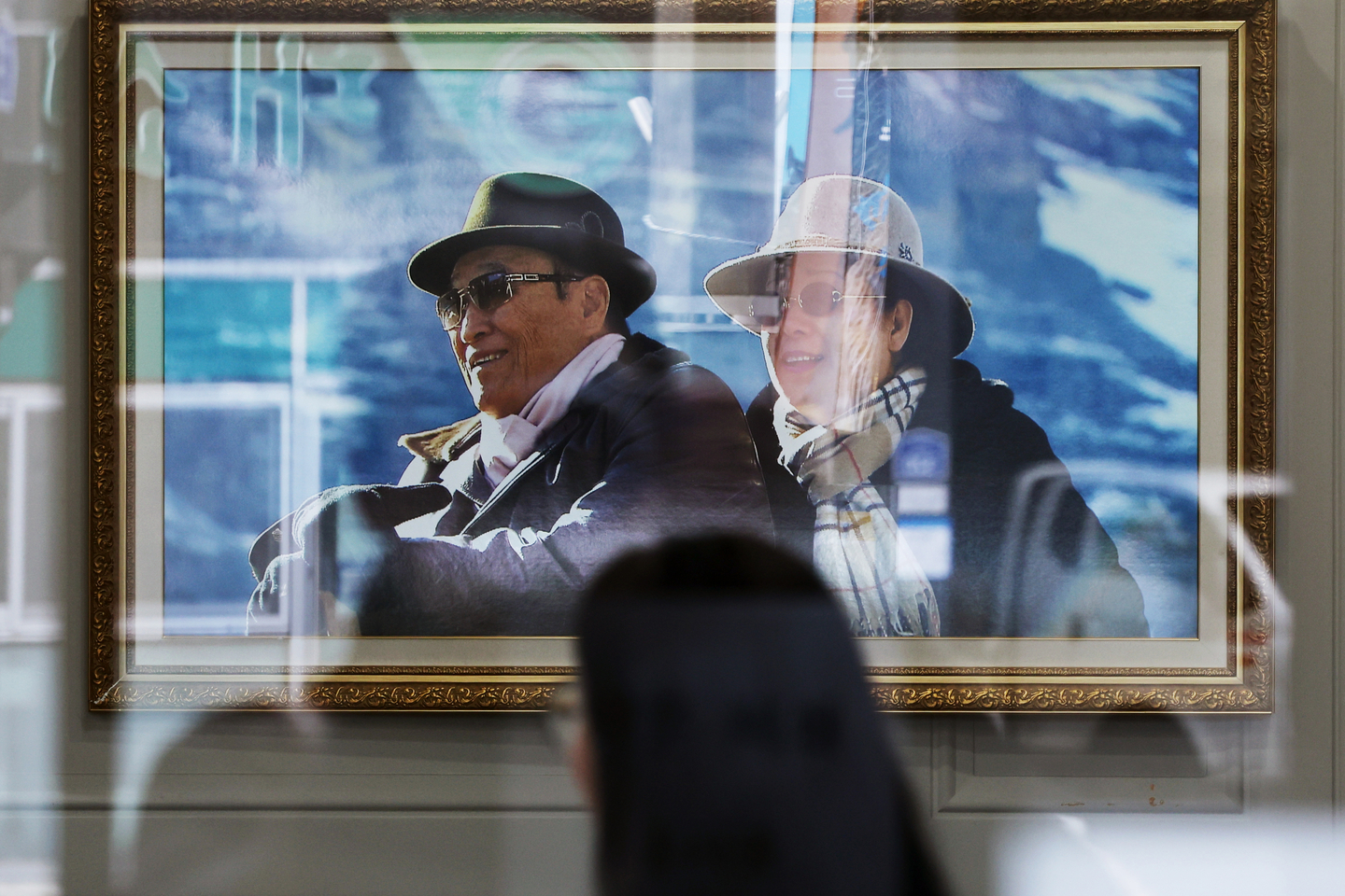 Photos of Unification Church leader Han Hak-ja, right, and the late founder Moon Sun-myung hang in the lobby of the church’s Korean headquarters in Yongsan District, Seoul, on Dec. 15, 2025. [NEWS1]