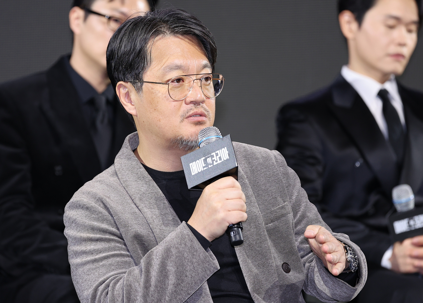 Director Woo Min-ho answers questions during a media conference for the Disney+ series “Made in Korea” (2025) at InterContinental Seoul Parnas in Gangnam District, southern Seoul, on Dec. 15, 2025. [YONHAP]