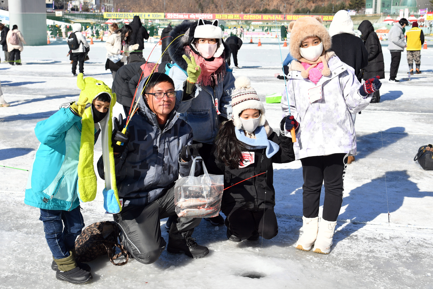 Visitors pose for photos at the 2026 Hwacheon Sancheoneo Ice Festival, in Hwacheon County, Gangwon on Jan. 24. [YONHAP] 