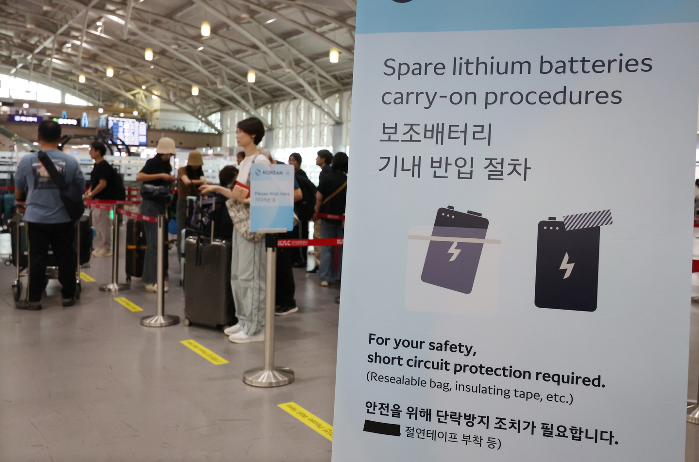 A notice on taking portable batteries on flights is seen at Gimhae International Airport on Sept. 1, 2025. [YONHAP]