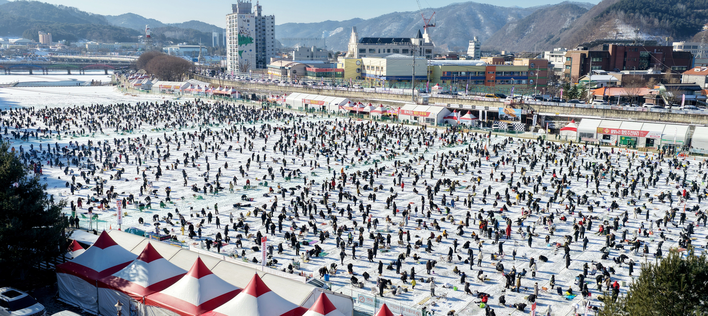 Visitors ice fish at the 2026 Hwacheon Sancheoneo Ice Festival, in Hwacheon County, Gangwon, on Jan. 24. [YONHAP] 