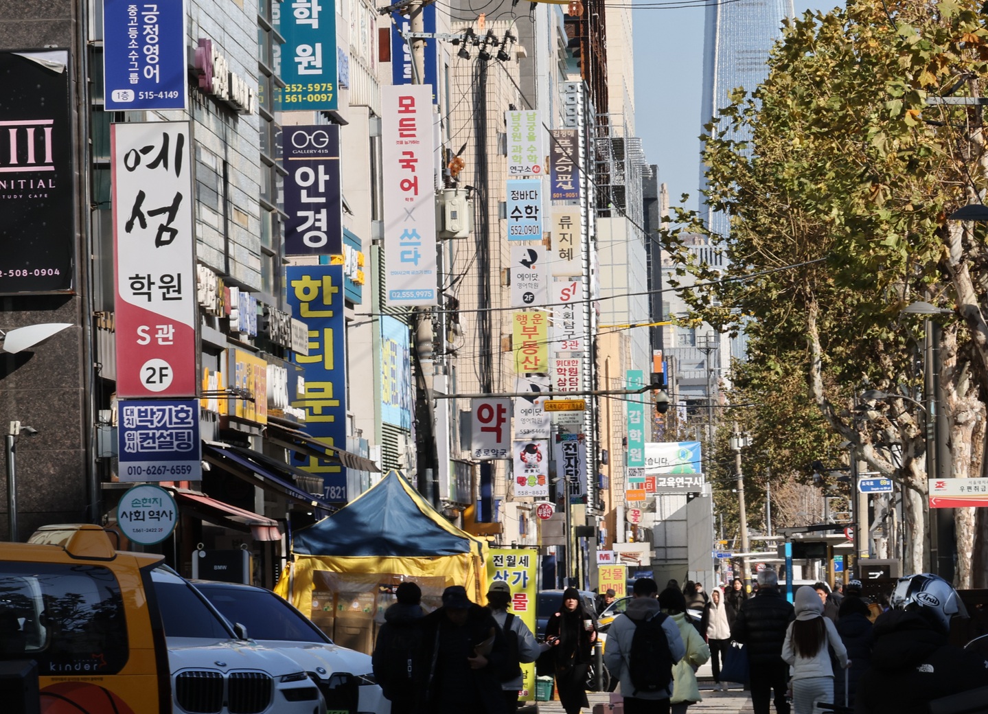 People walk on a street in Daechi-dong, a neighborhood dense with private education institutes in Gangnam District, southern Seoul, on Dec. 4, 2025. [YONHAP]