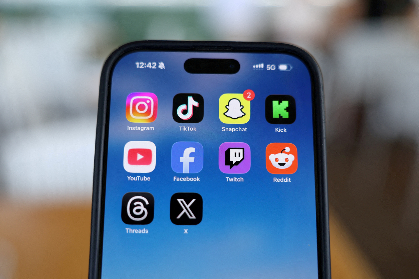 Instagram, TikTok, Snapchat, Kick, YouTube, Facebook, Twitch, Reddit, Threads and X applications are displayed on a mobile phone in this picture illustration taken on Dec. 9, 2025. [REUTERS/YONHAP]