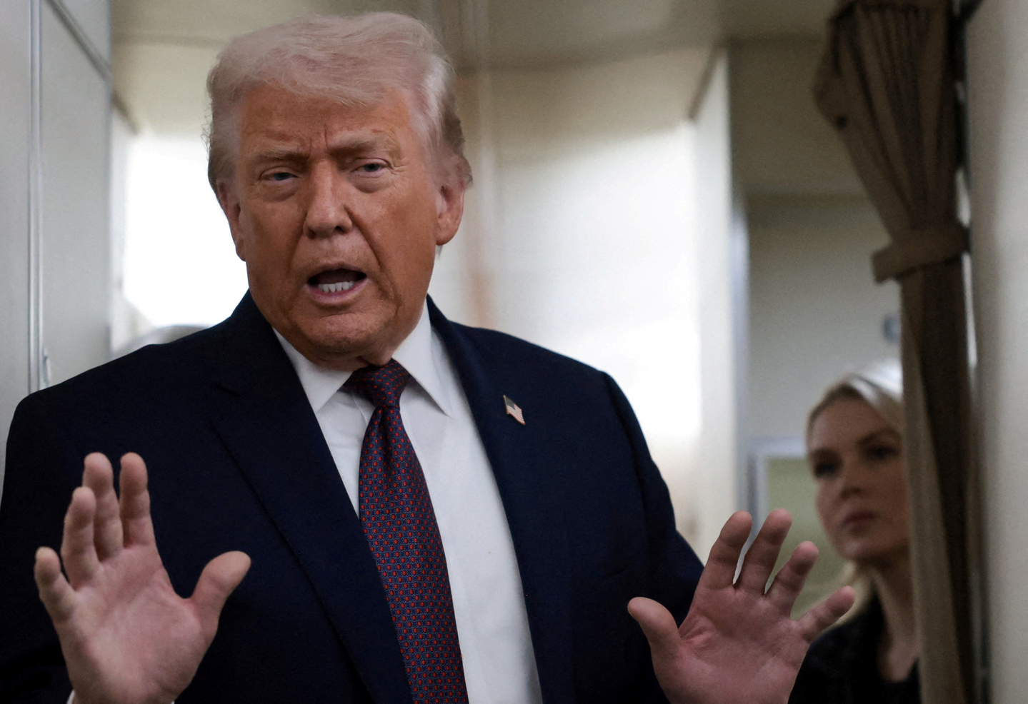 U.S. President Donald Trump speaks to reporters over the North Atlantic as he returns to Washington from the World Economic Forum in Davos, Switzerland, aboard Air Force One on Jan. 22. [REUTERS/YONHAP]