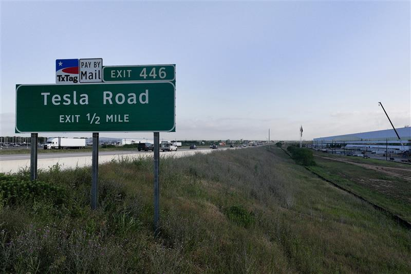 A highway sign for Tesla Road is seen near the Tesla Giga Texas factory on May 17, 2022, in Austin, Texas. [GETTY IMAGES]