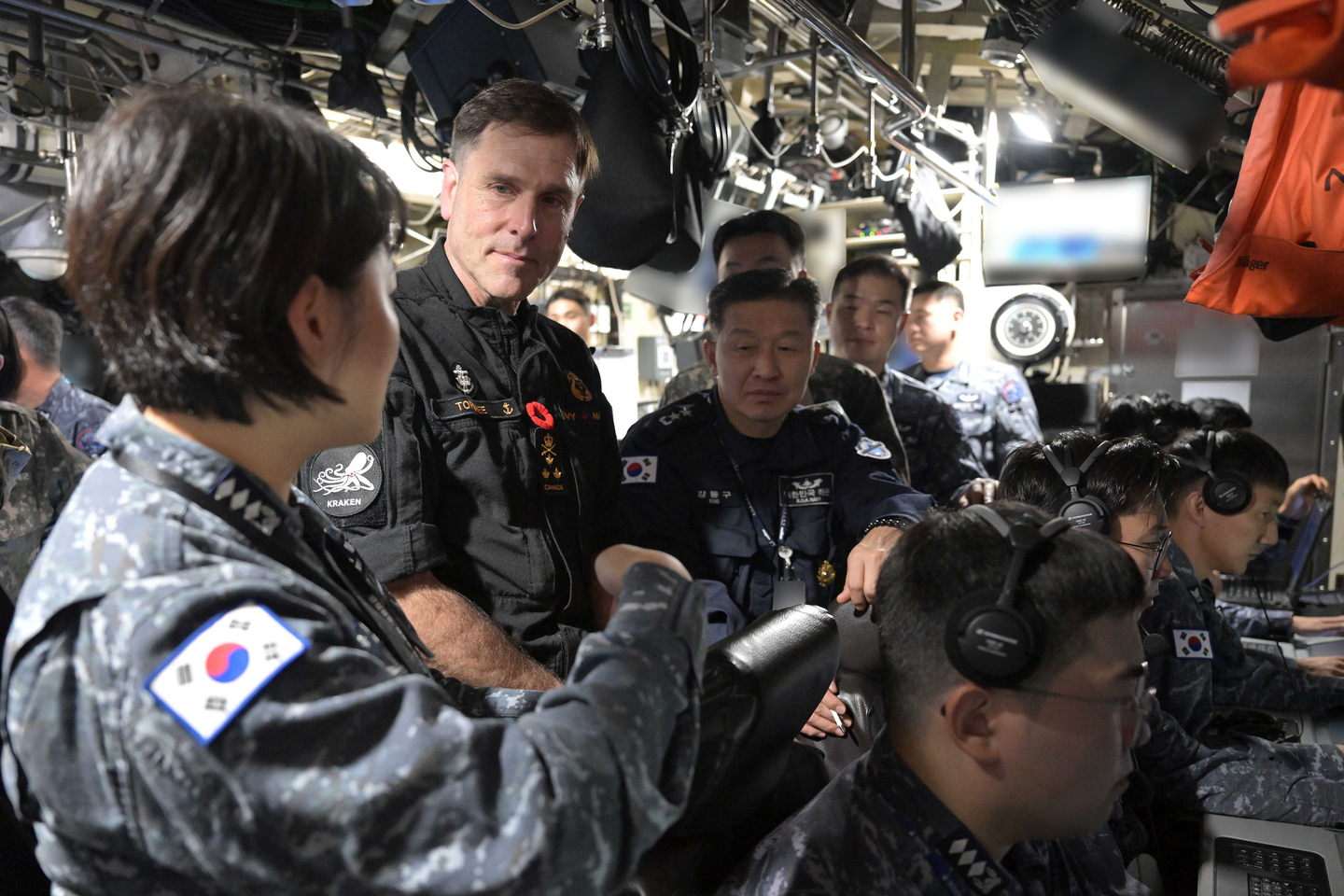 Commander of the Royal Canadian Navy Vice-Admiral Angus Topshee, second from left, takes a look at the KSS-III submarine on Oct. 31, 2025 [REPUBLIC OF KOREA NAVY] 