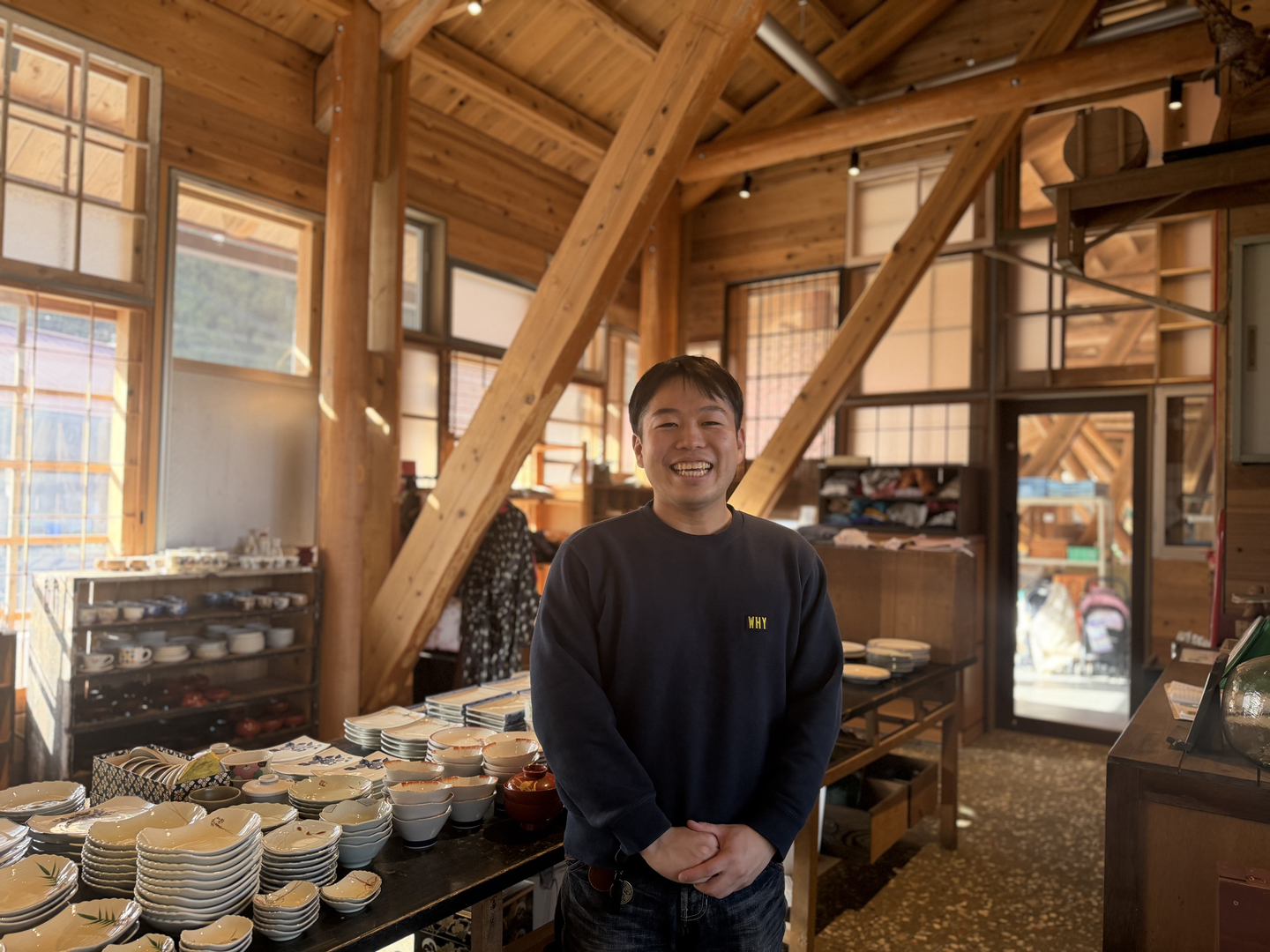 Takuma Kisanuki, an operations staff member, poses for a photograph during a media interview at an indoor thrift shop at the Kamikatsu Zero Waste Center in Tokushima, Japan, on Jan. 26. [LEE SOO-JUNG]
