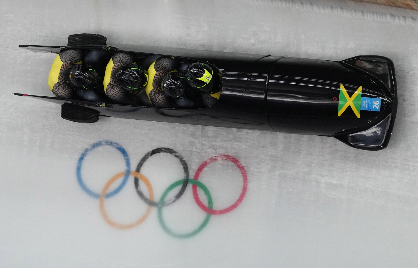 The Jamaica bobsleigh team, with pilot Shanwayne Stephens, is seen in action during Heat 3 of the Four-Man Bobsleigh race at the Yanqing National Sliding Centre at the Beijing 2022 Olympic Games in China on Feb. 20, 2022. [EPA/YONHAP]