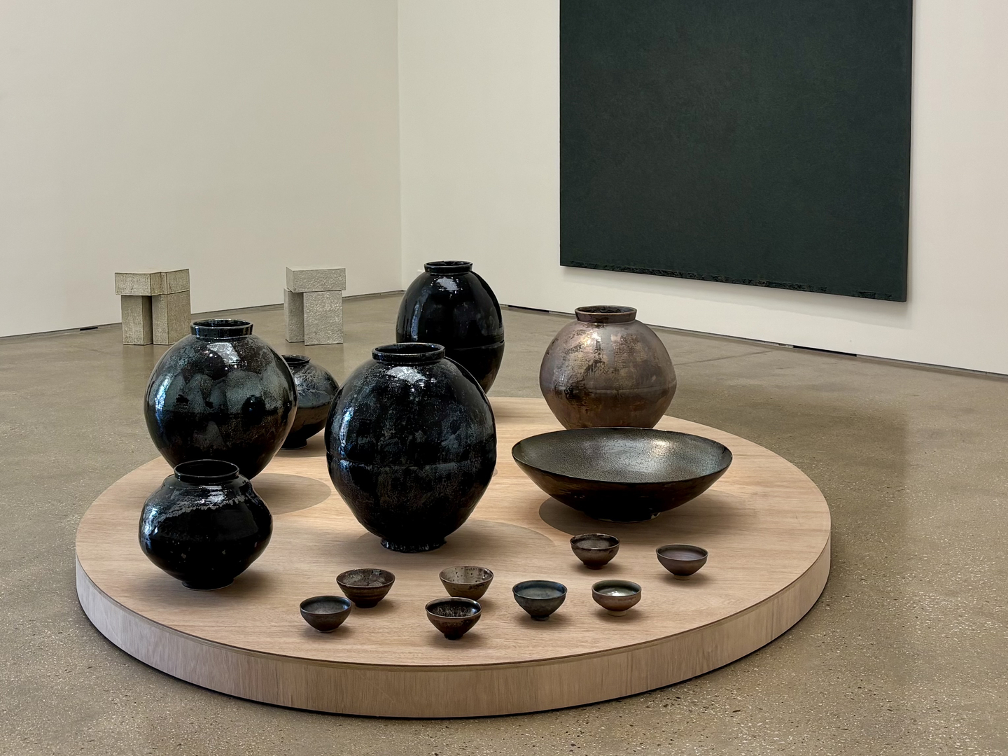 Counterclockwise, from front: Earthenware by Kim Sy-young, mulberry bark painting by Chung Chang-sup and architecture-inspired sculptures by Lee Myung-jin are on display at PKM Gallery's latest show, "From Hands" during a press preview on Feb. 3, in Jongno District, central Seoul. [LEE JIAN]