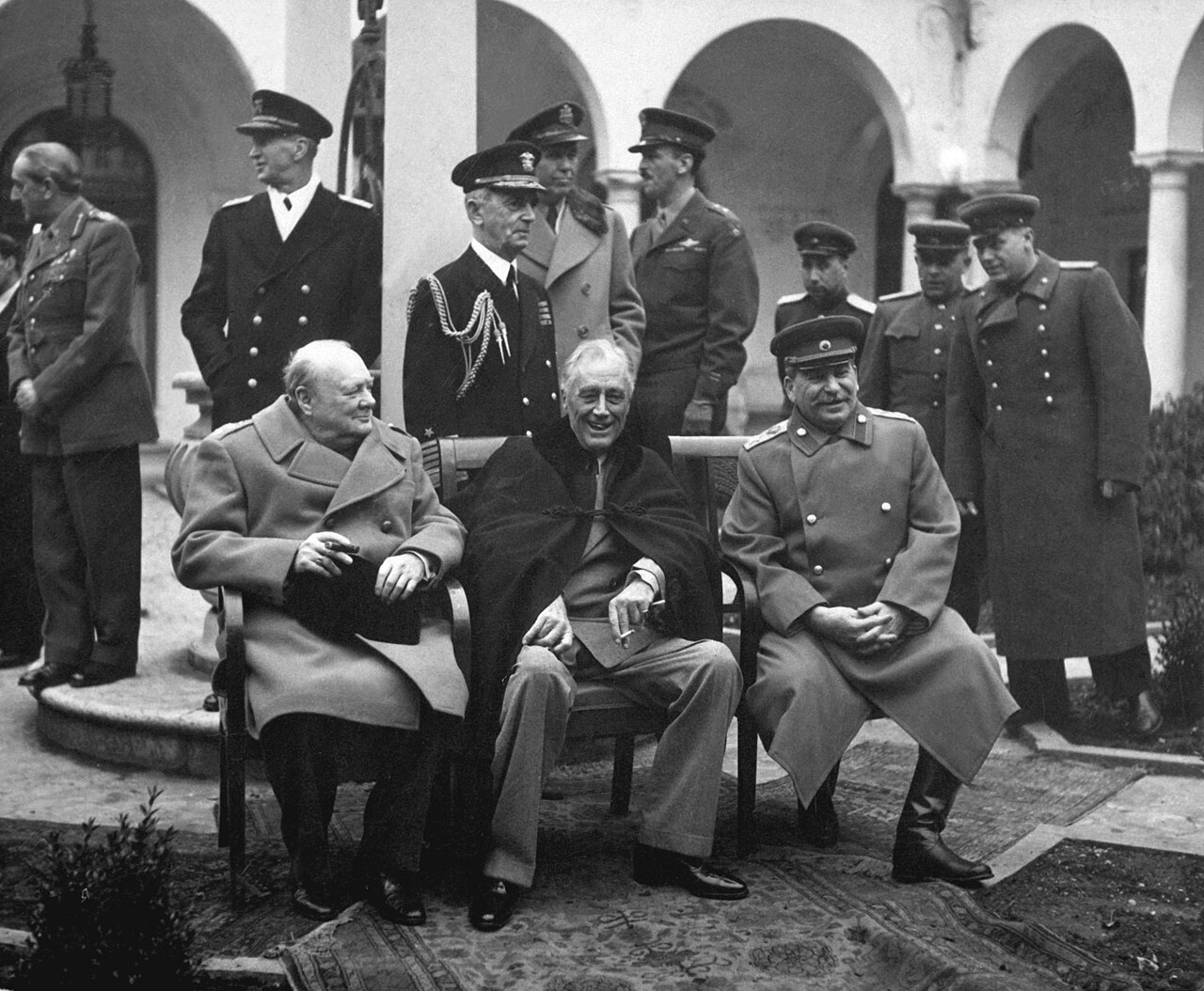 Prime Minister Winston S. Churchill, left, President Franklin D. Roosevelt, center, and Premier Joseph Stalin attend the Yalta Conference in February 1945, where they decided Germany's post-war fate. [WIKIPEDIA]