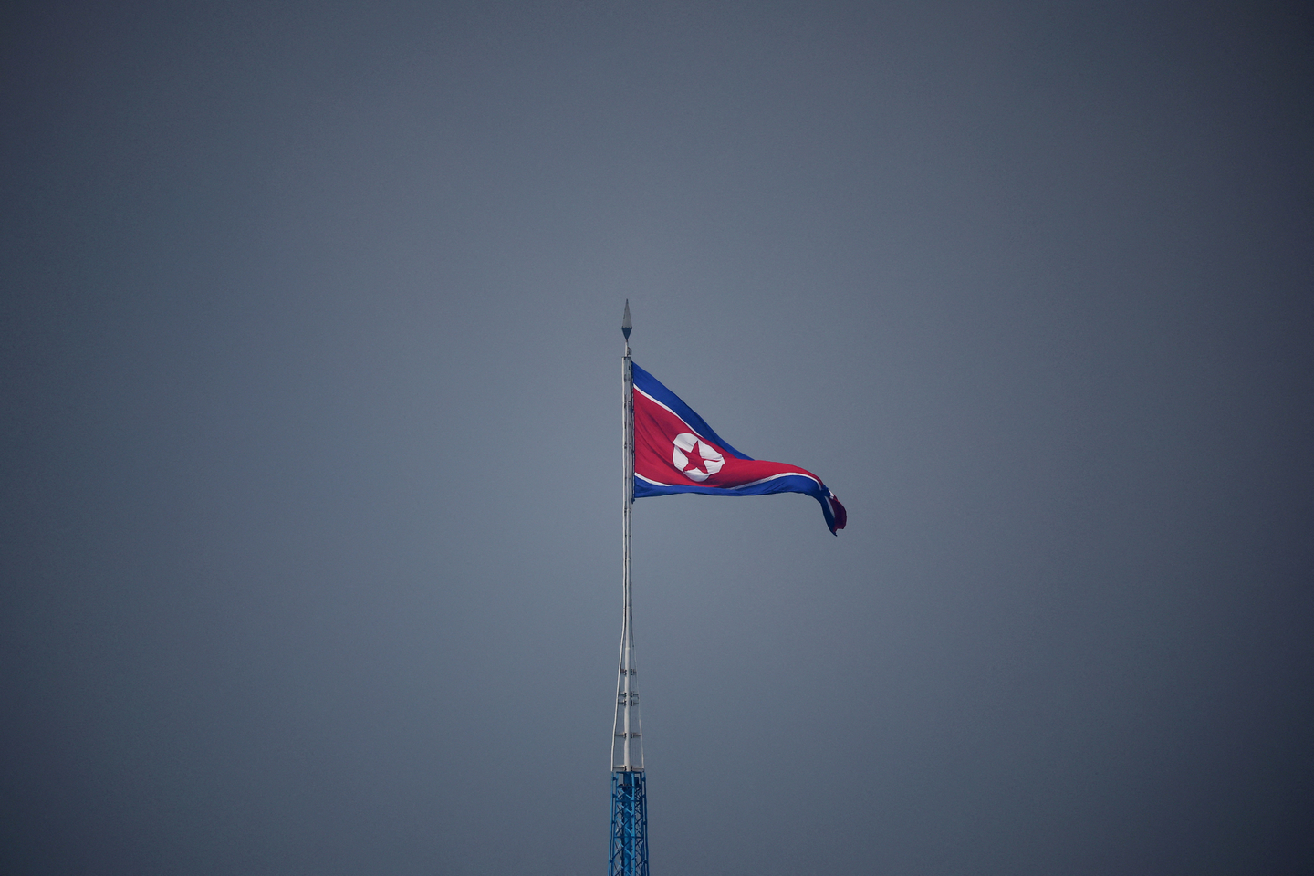 A North Korean flag flutters at the propaganda village of Gijungdong in North Korea, in this picture taken near the truce village of Panmunjom inside the demilitarized zone in South Korea on July 19, 2022. [REUTERS/YONHAP] 