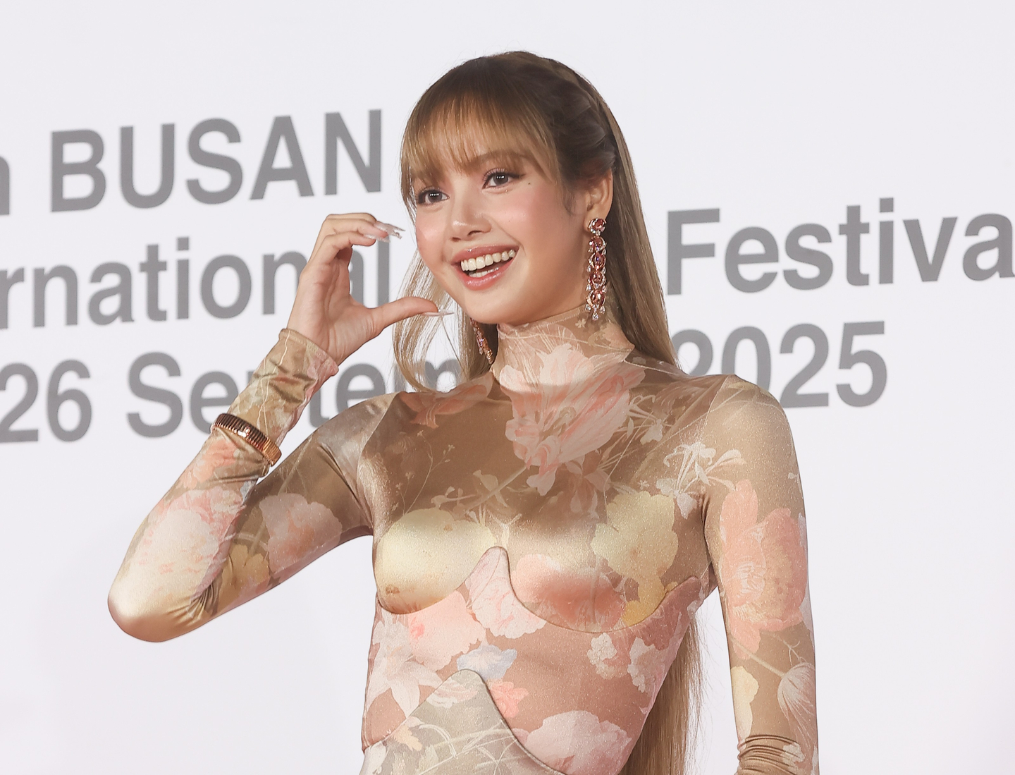 Blackpink's Lisa poses for the red carpet at the opening ceremony of the Busan International Film Festival at the Busan Cinema Center in Haeundae District, Busan, on Sept. 17, 2025. [YONHAP]