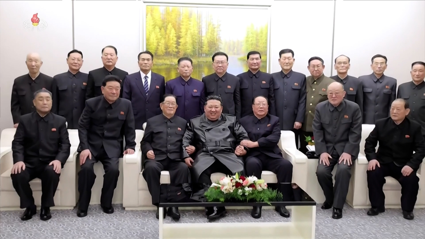 North Korean leader Kim Jong-un, first row fourth from left, is seen posing with officials during a visit to the Ministry of National Defense on the occasion of the 78th anniversary of the founding of the Korean People’s Army, also known as Army Day, on Feb. 8. [RODONG SINMUN]
