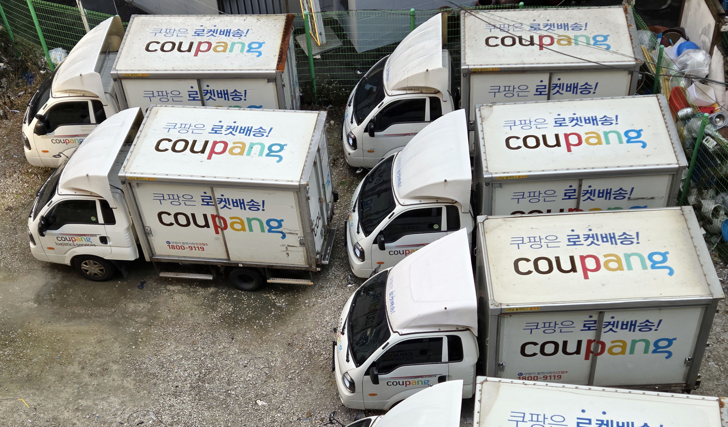 Coupang trucks are parked in Seoul on Dec. 14, 2025. [YONHAP] 