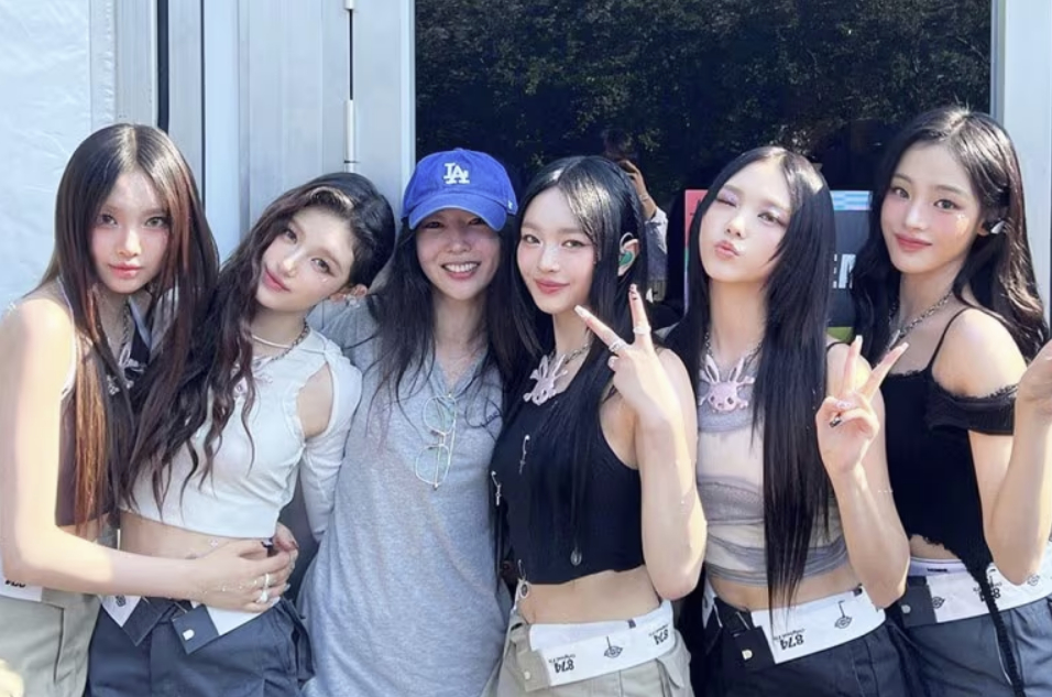 Members of girl group NewJeans and CEO of their agency ADOR, Min Hee-jin, third from left [SCREEN CAPTURE]