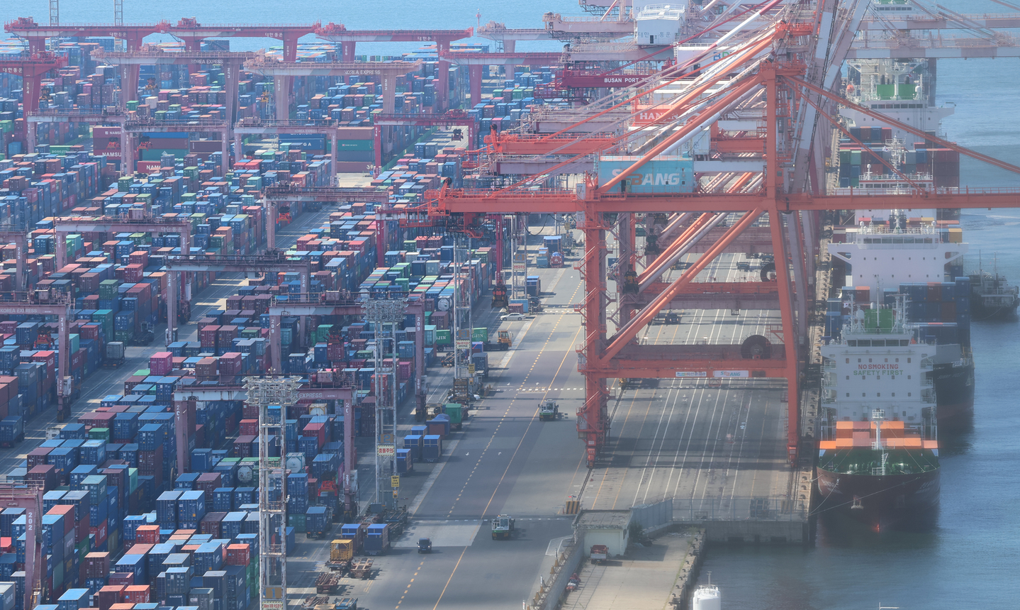 An export and import cargo is stacked at Sinseondae Terminal in Busan Port on July 31, 2025.  [YONHAP] 