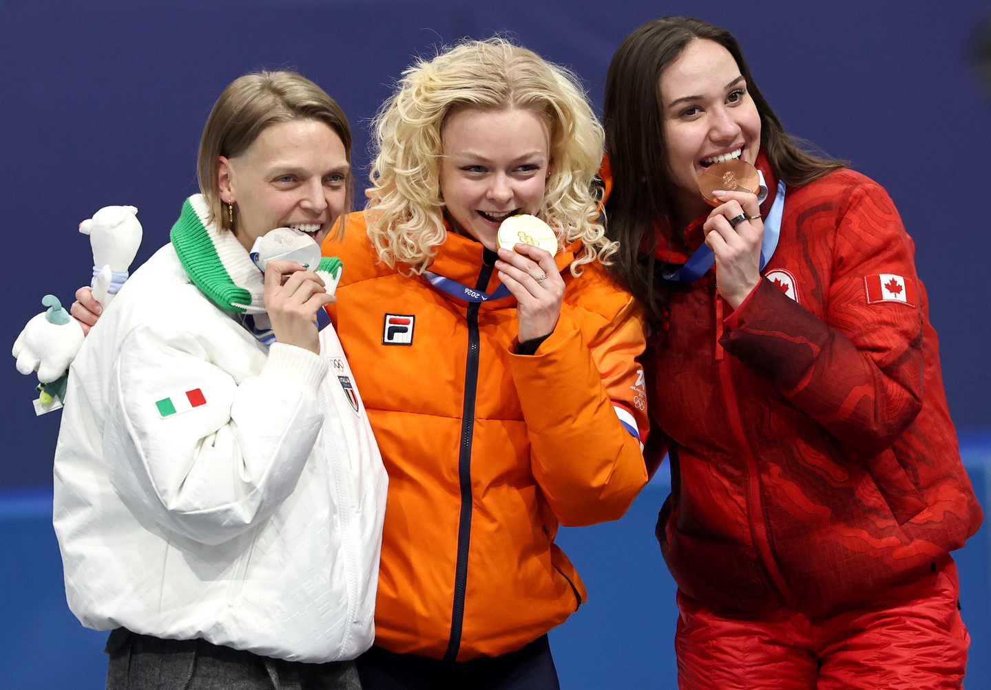 Silver medalist Ariana Fontana of Italy, left, gold medalist Xandra Velzeboer of the Netherlands, center, and bronze medalist Courtney Sarault of Canada pose with their medals during the medal ceremony for the Women's 500 meters of the short track speed skating competitions at the Milan-Cortina 2026 Winter Olympic Games in Milan on Feb. 12. [EPA/YONHAP]