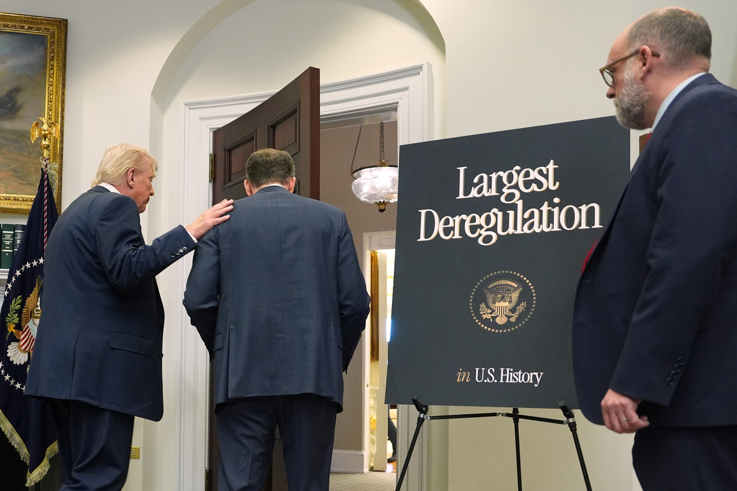 U.S. President Donald Trump departs with Environmental Protection Agency director Lee Zeldin after announcing the EPA will no longer regulate greenhouse gases, in the Roosevelt Room of the White House in Washington on Feb. 12. [AP/YONHAP]