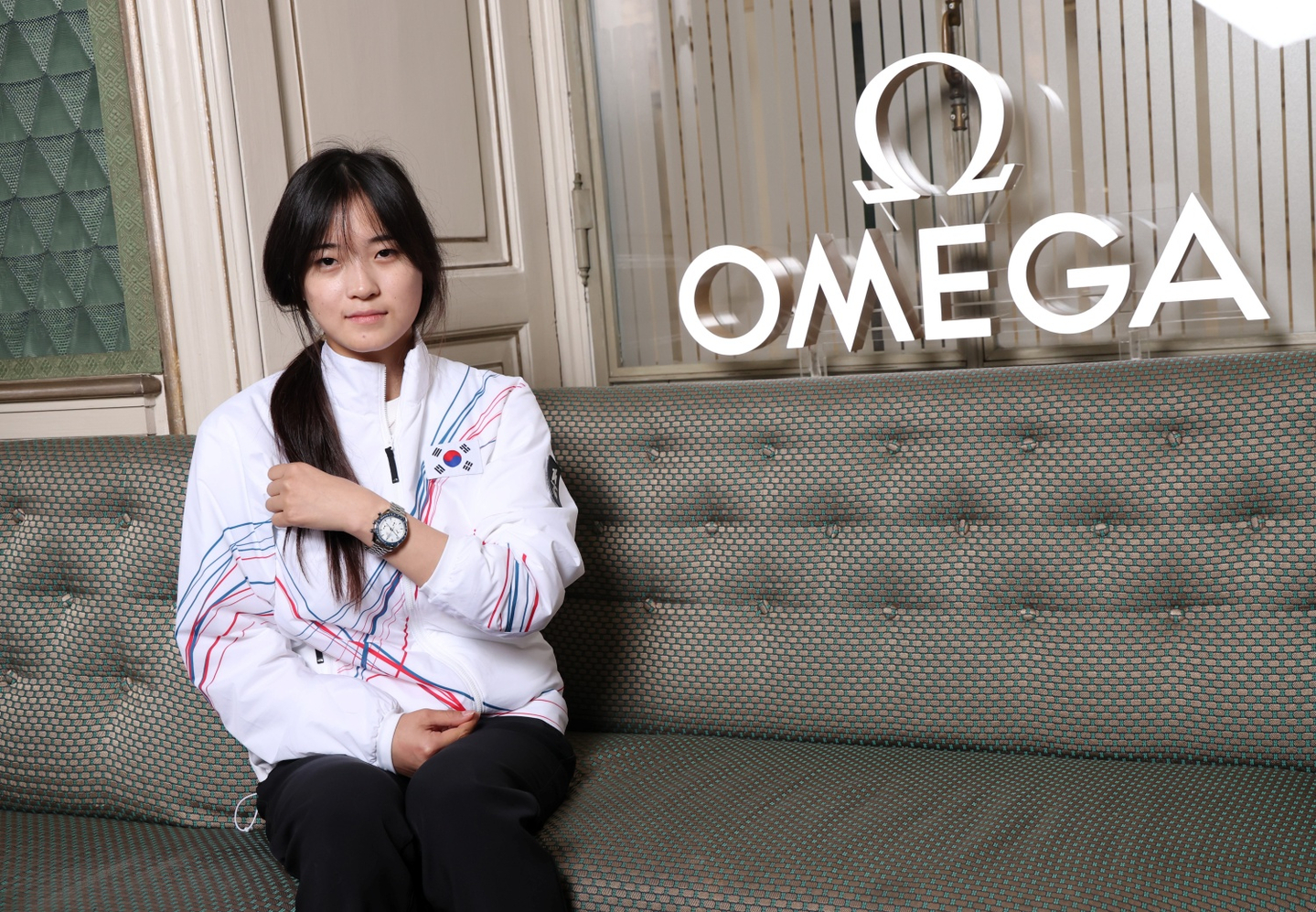 Choi Ga-on, Korea’s first gold medalist of the Milan-Cortina 2026 Winter Olympics, poses for a photo after receiving a luxury wristwatch from Omega, the official timekeeper of the Games, at the Omega House in Milan on Feb.14. Omega presented Choi with the commemorative Speedmaster 38mm Milano Cortina 2026 edition. [OMEGA]