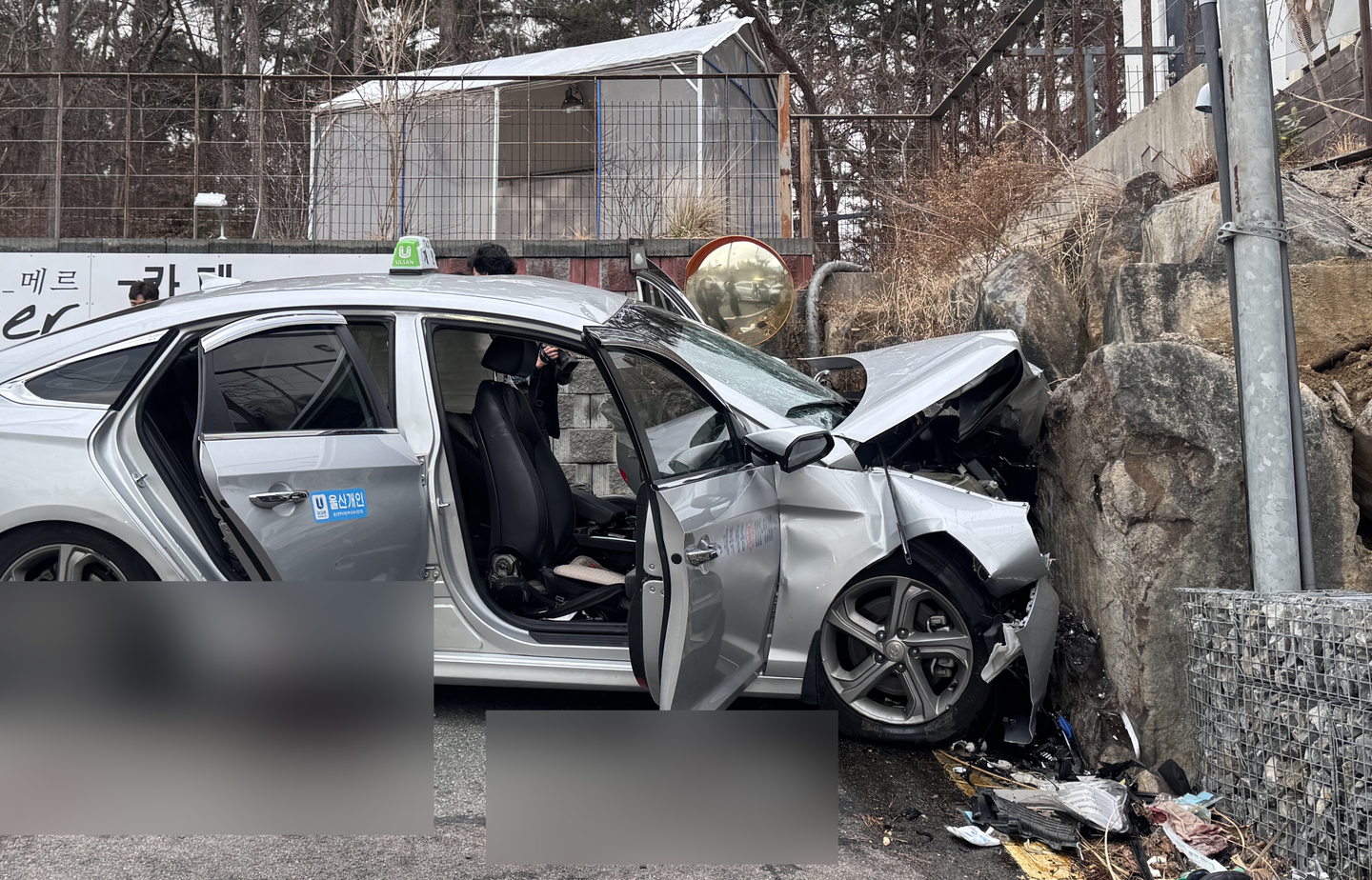 A taxi is broken after crashing into a wall while driving on a road in Ulsan on March 6, 2025. [NEWS1]