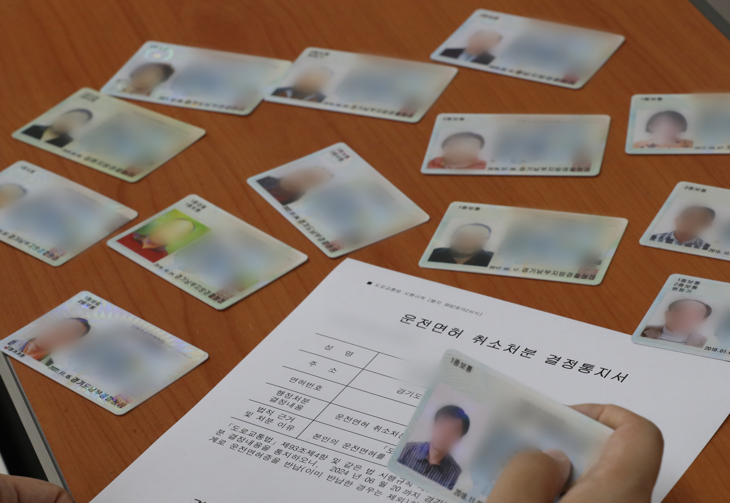 A civil servant sorts returned driver’s licenses at the Suwon City Hall in Suwon, Gyeonggi, on July 3, 2024. [NEWS1] 