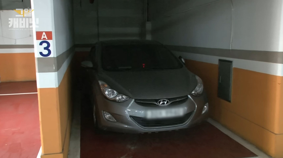 A vehicle belonging to Jeon Min-geun and Choi Sung-hee sits abandoned in the parking garage of their apartment building in this footage broadcast by the Korean investigative program "Unanswered Questions" following their disappearance in May 2016. [SCREEN CAPTURE]