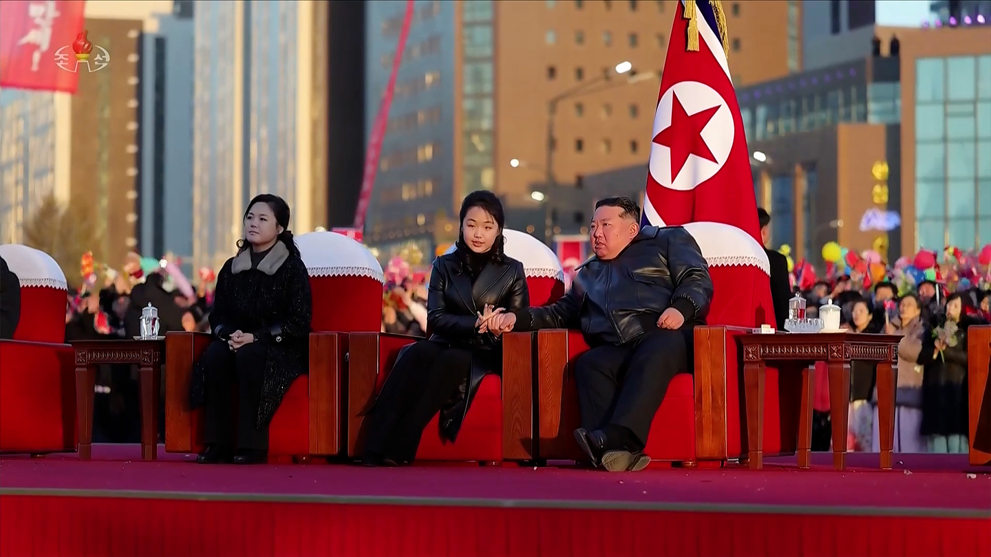 North Korean leader Kim Jong-un, center right, is seen holding hands with daughter Kim Ju-ae, center, during a completion ceremony for houses in Hwasong district in Pyongyang on Feb. 16, in this screengrab from the state-run Korean Central Television. [YONHAP] 