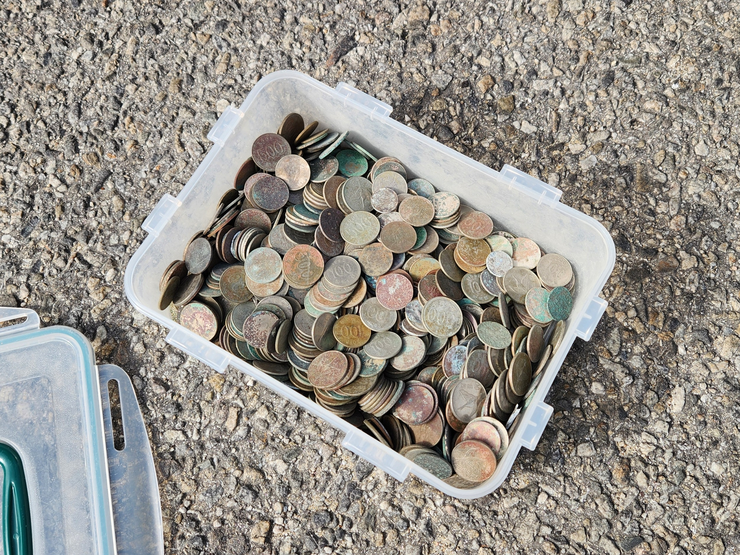 A box of coins found with metal detectors by a member of a metal detecting club [LEE GYU-RIM]