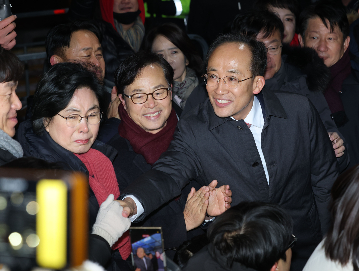 Rep. Choo Kyung-ho of the People Power Party, far right in front, accused of obstructing lawmakers from voting to lift martial law on the Dec. 3, 2024, leaves Seoul Detention Center in Uiwang, Gyeonggi, on Dec. 3, 2025, after a court dismissed a request for his arrest warrant. [YONHAP]