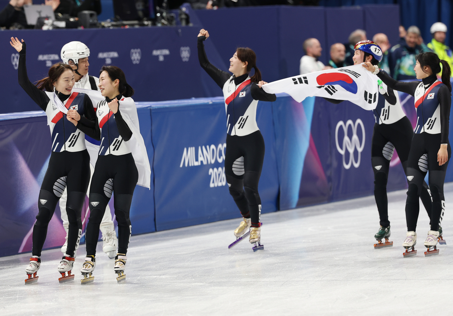 Members of the Korean women's short track speed skating relay team celebrate their gold medal at the Winter Olympics at the Milano Ice Skating Arena in Milan on Feb. 18. [YONHAP] 
