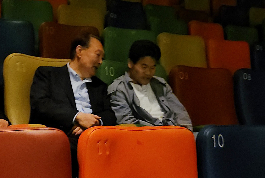 Former President Yoon Suk Yeol, left, speaks with former history lecturer Jeon Han-gil ahead of a screening of the movie ″Election Fraud: A Work of God?″ (2025) Megabox Dongdaemun in eastern Seoul on May 21, 2025. [NEWS1] 